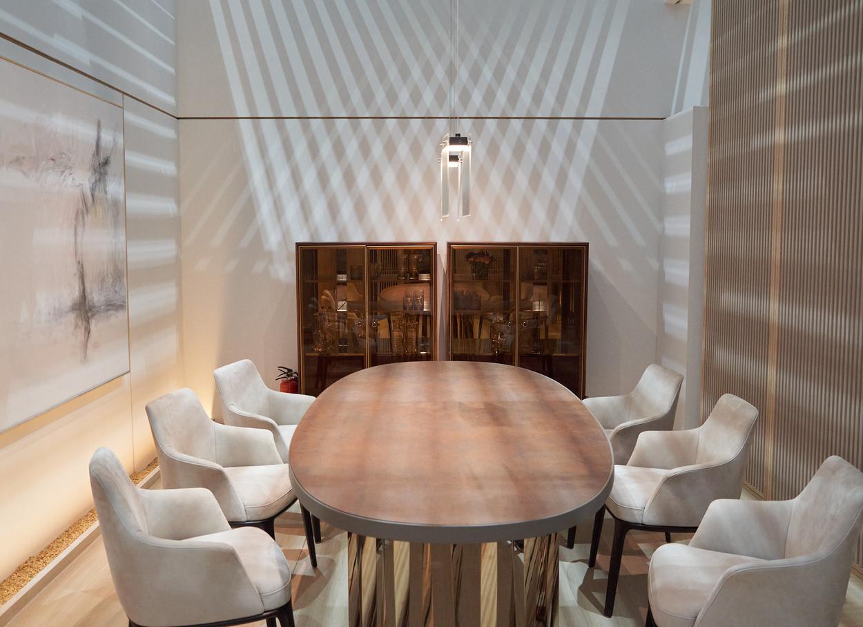 Dining room — oval table, armchairs, display cabinets