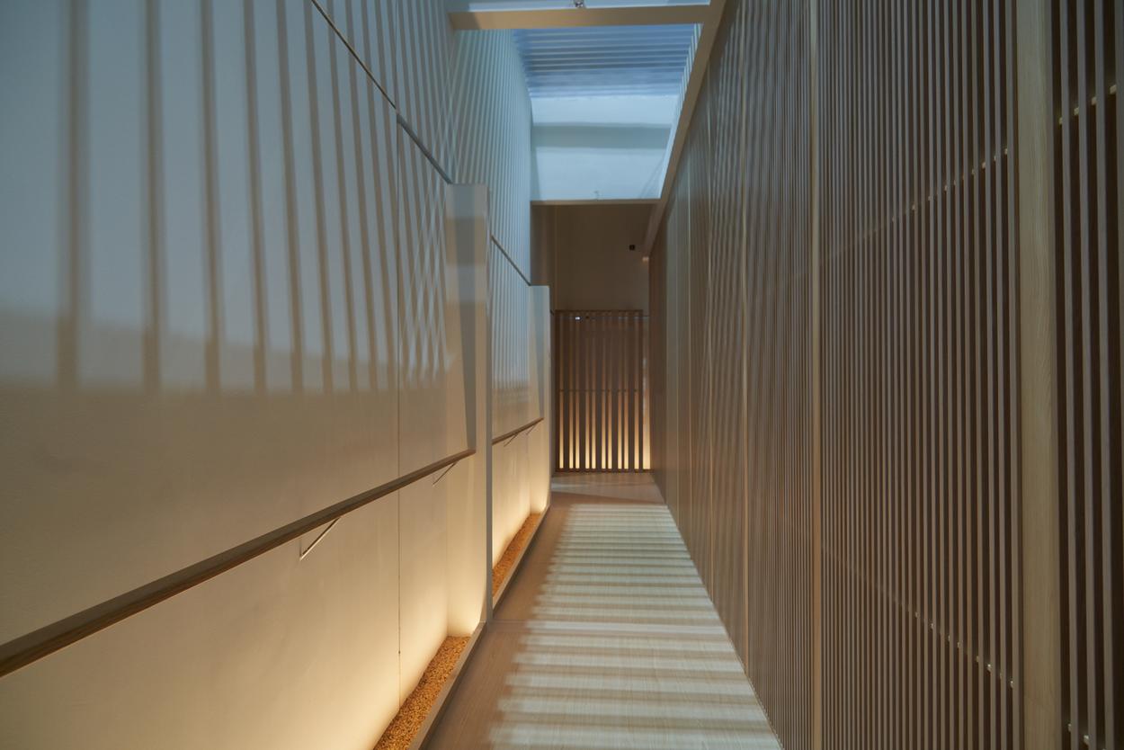 Slatted timber corridor with concealed lighting