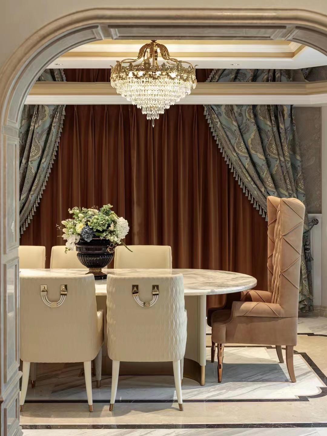 Dining room — marble table and upholstered chairs