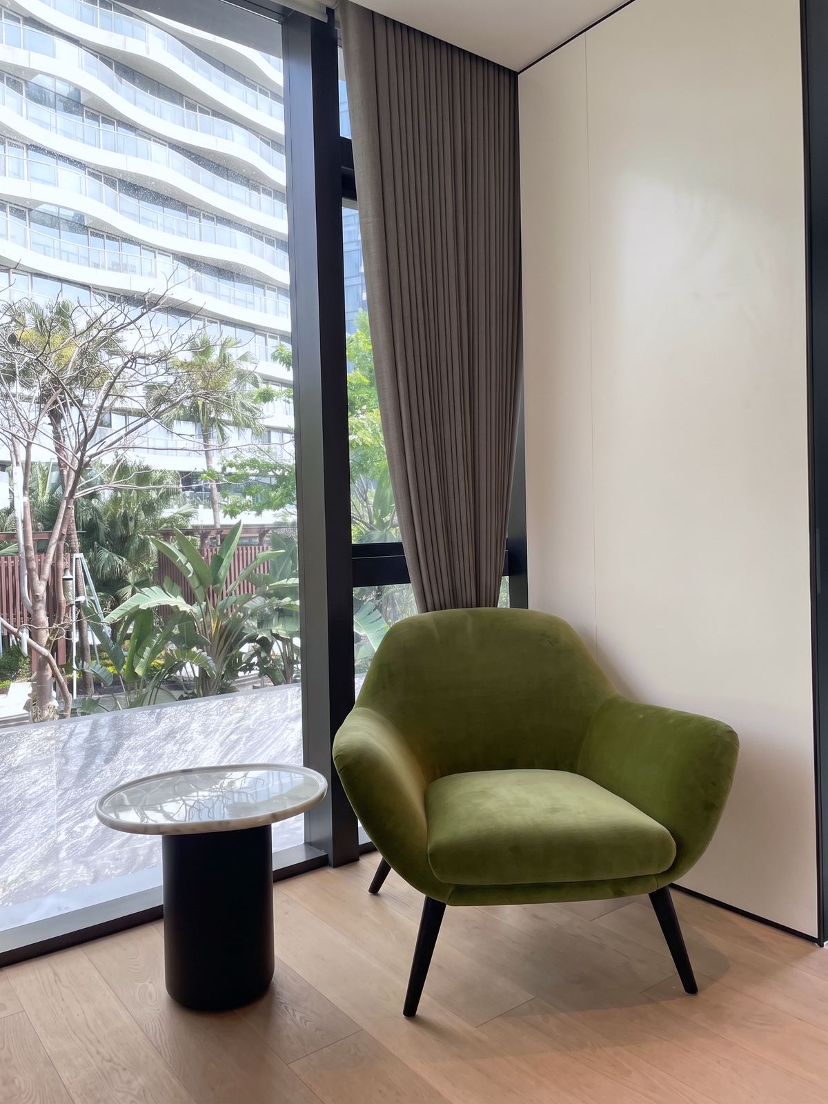 A pair of velvet chairs in the games room